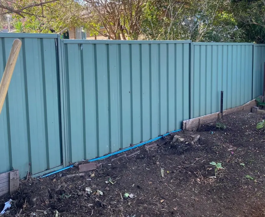 Newly replaced Colorbond fence by trusted fencing contractors in Launceston